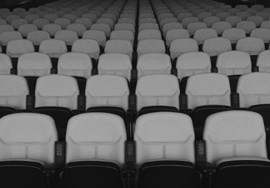 Vintage movie theater seats in black and white
