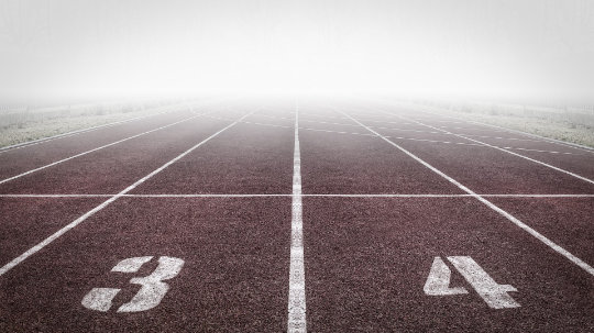 Track lanes disappearing into mist